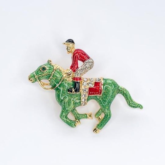 green & red race horse and jockey with diamante saddle brooch