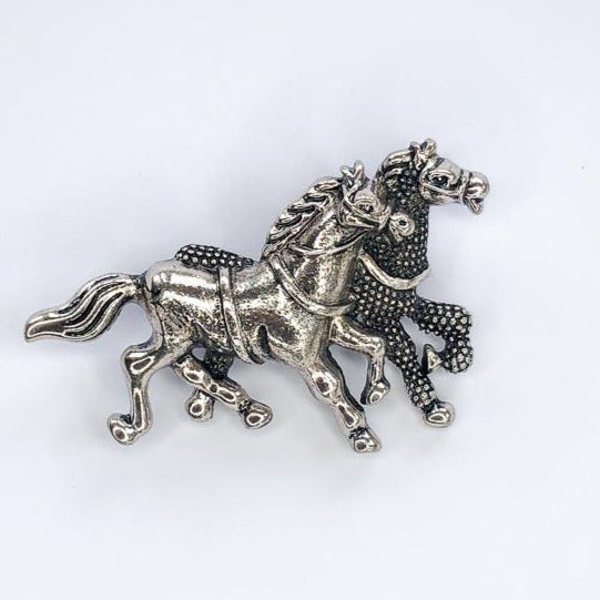 two silver horses galloping brooch