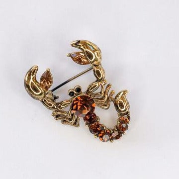 gold and topaz crystal scorpion brooch at erika