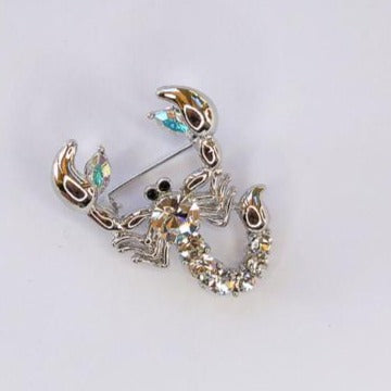 silver and clear crystal scorpion brooch at erika