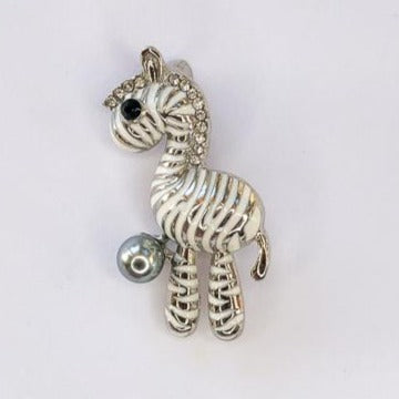 white and silver zebra with grey pearl brooch at erika